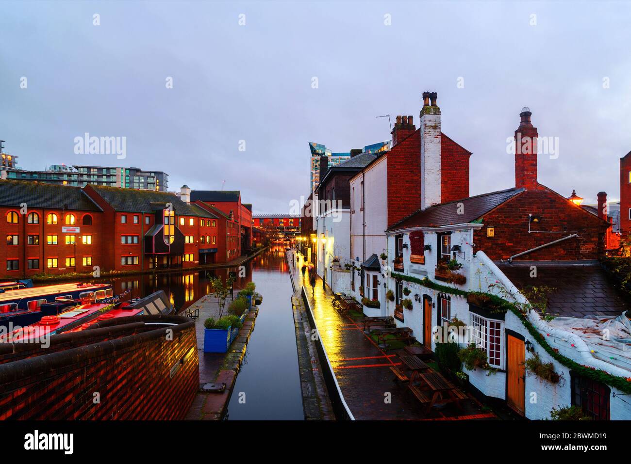 Birmingham, UK. Embankments during the rain in the evening at famous Birmingham canal in UK. Cloudy sky at sunset Stock Photo