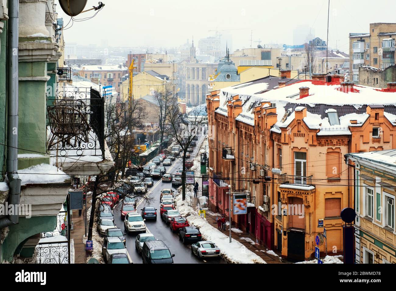 Kyiv, Ukraine. Mykhailivska Street in Kyiv, Ukraine, with historical old buildings on a winter foggy day Stock Photo