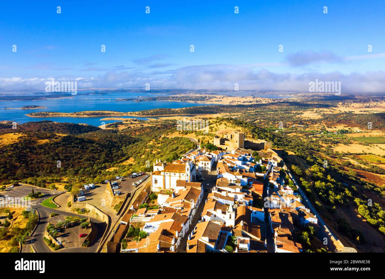 Monsaraz, Portugal. Aerial view of a hstorical town Monsaraz, Portugal with castle and old buildings. Landscape at the background Stock Photo