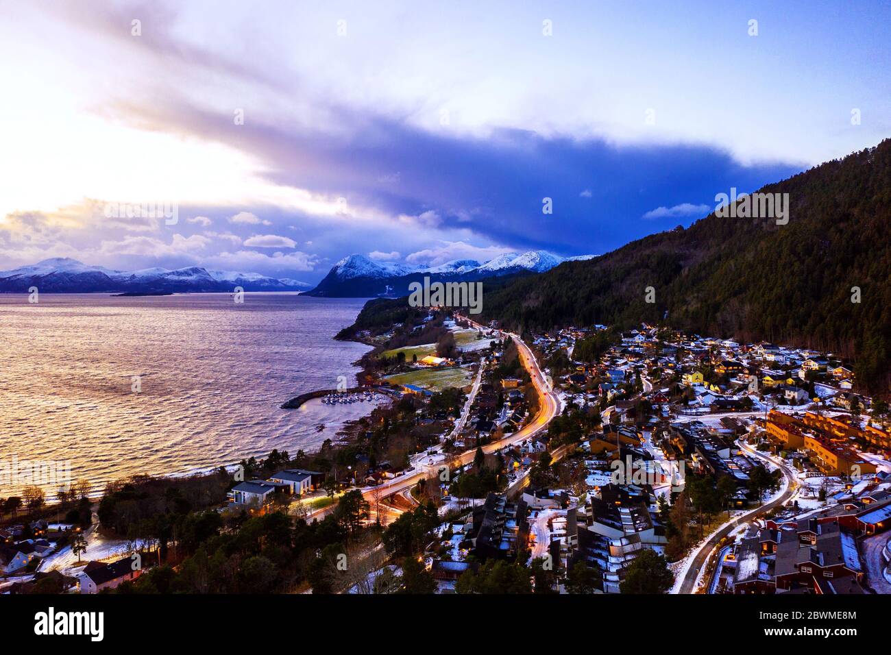 Molde, Norway. Aerial view of residential area in Molde, Norway at night. Beautiful fjord with mountains in winter Stock Photo