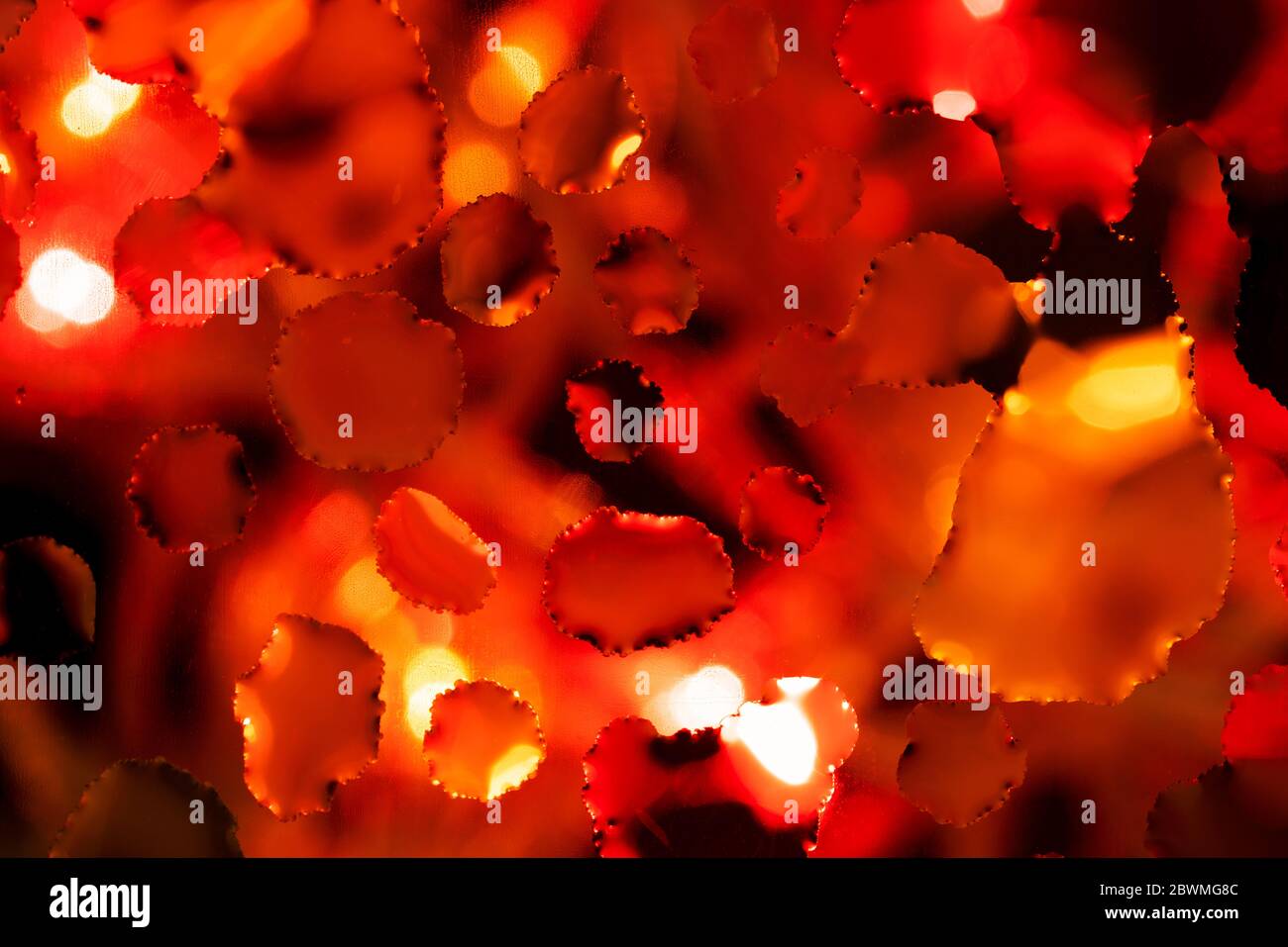 Abstract background with red tints splashes. Bubbles macro shot close-up Stock Photo