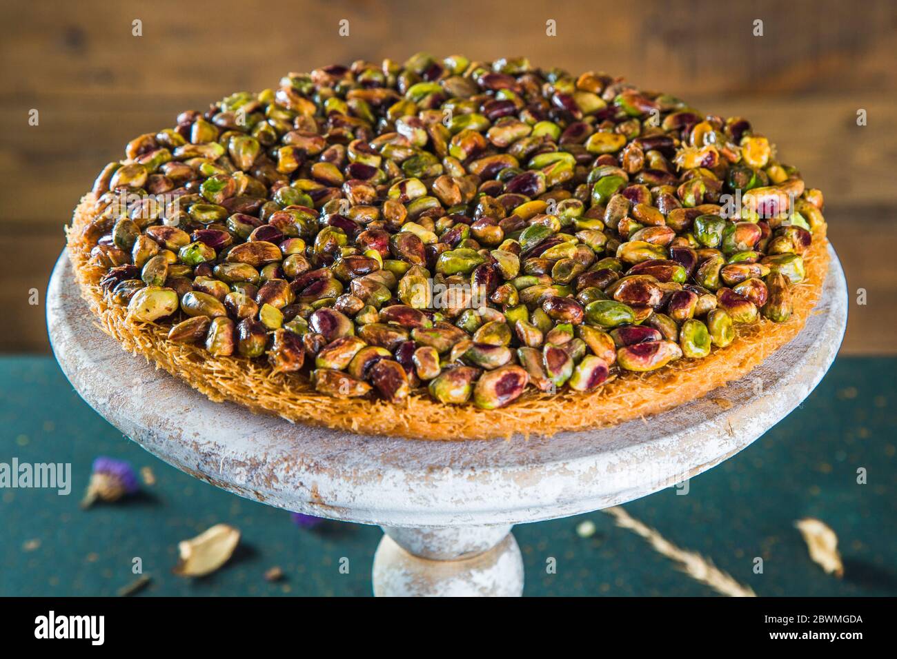 Arabic sweet dessert of kadaif and pistachios on stand Stock Photo Alamy