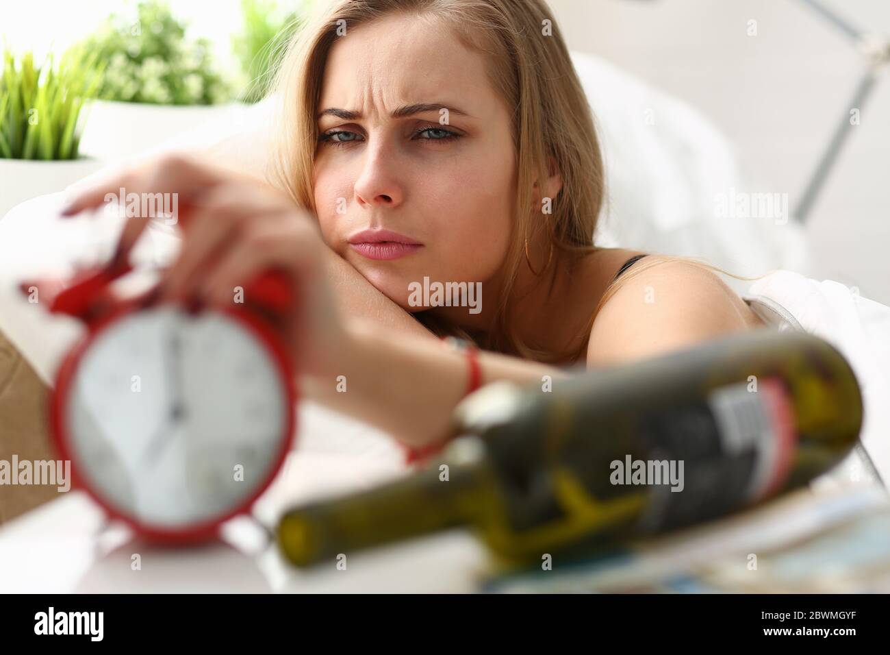 Exhausted female having headache after drinking wine Stock Photo Alamy