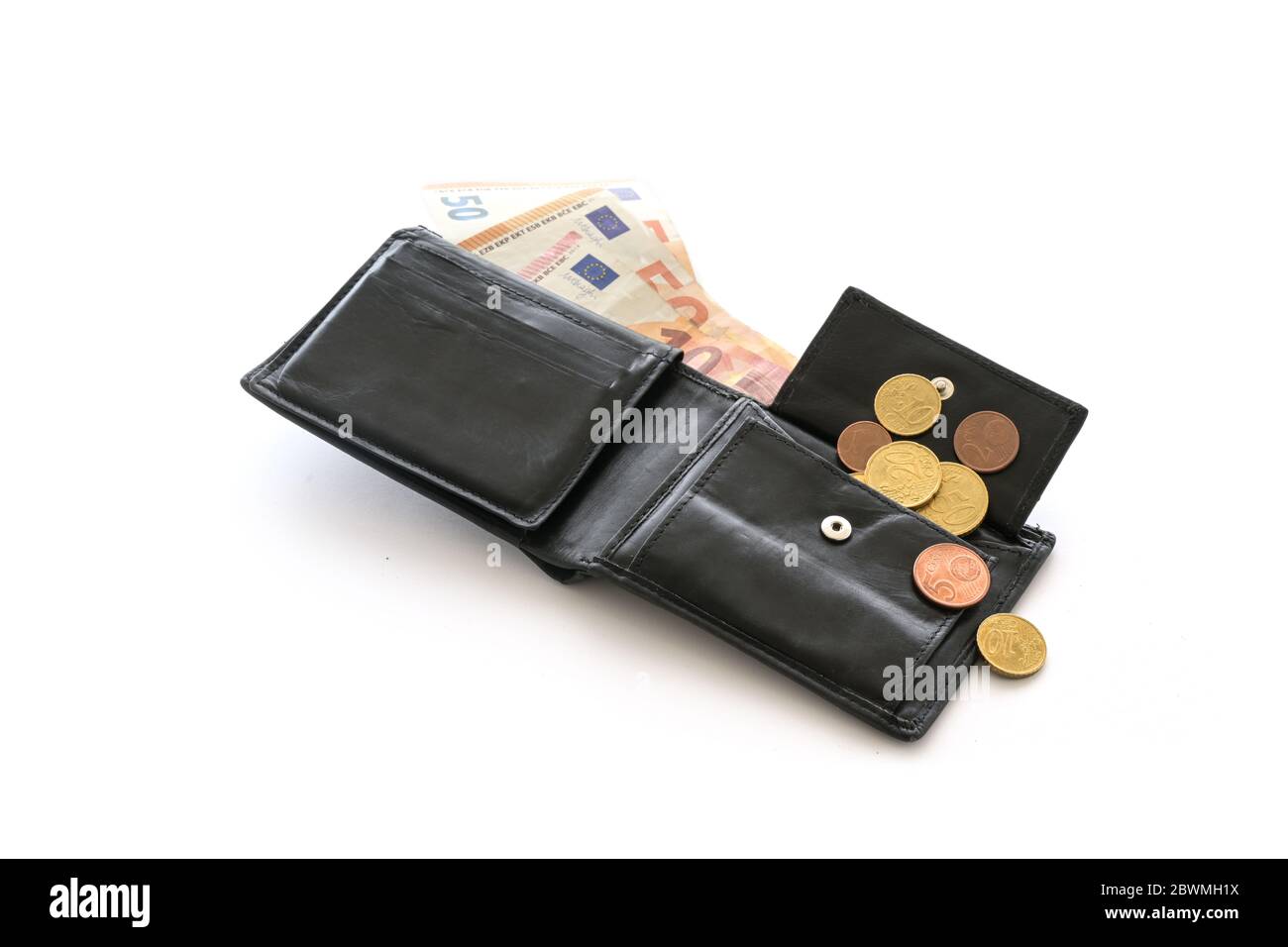 Open money purse with a few euro coins and notes, cash check, debt and poverty in the economic crisis affected by coronavirus, isolated on a white bac Stock Photo