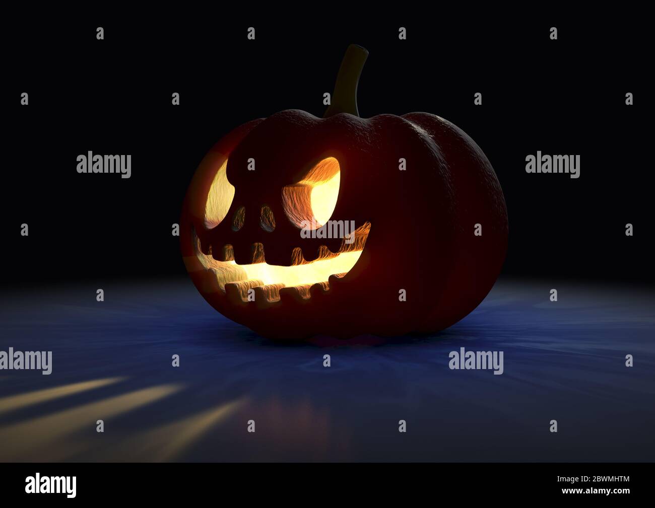 An illuminated halloween jack o lantern on an isolated dark background ...