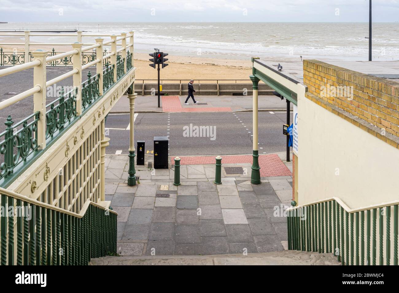 Man walking along Marine Drive on a cloudy day in Margate, Kent ...