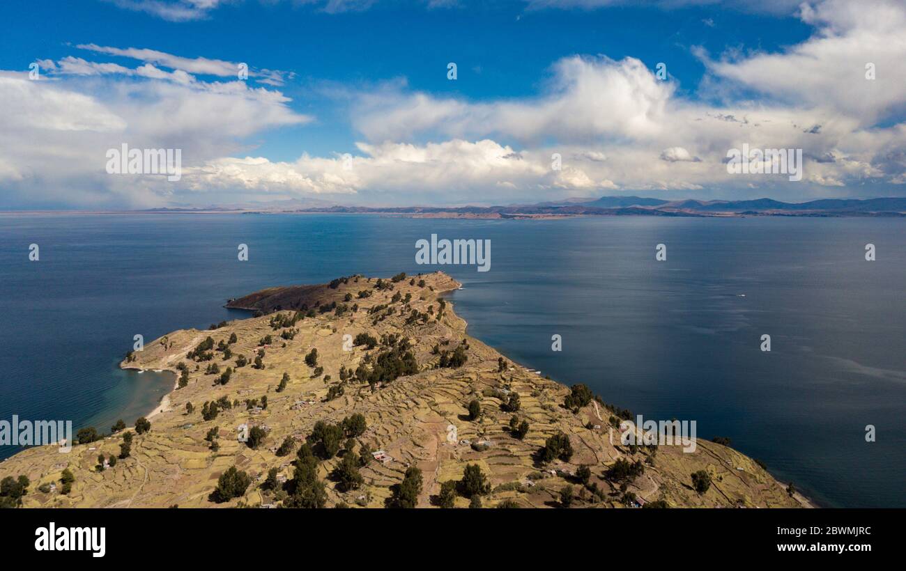Aerial view on terraced slopes of Taquile island on Titicaca Lake with other islands in the background. World's highest navigable lake view. Stock Photo