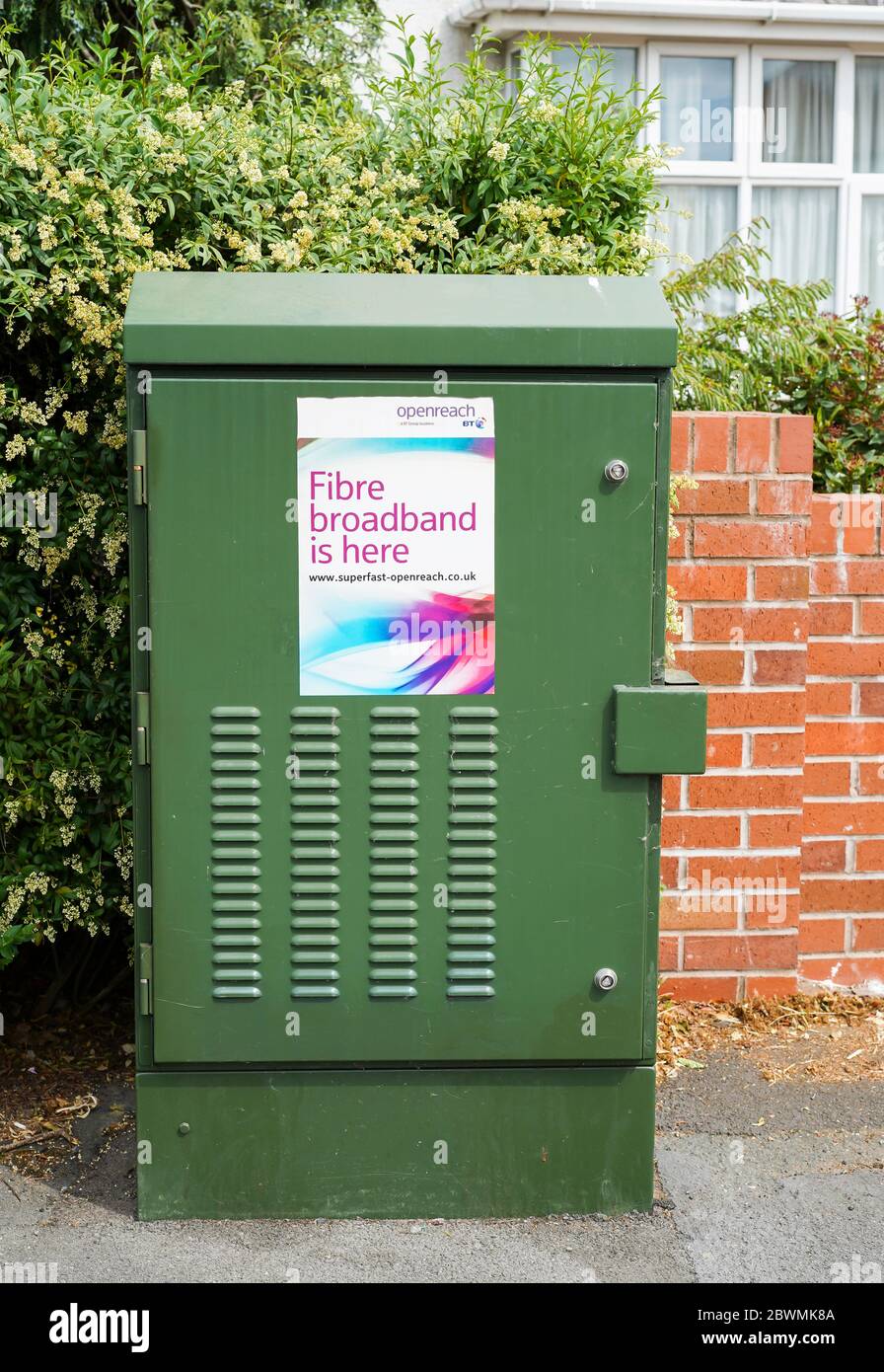 Close up of green Openreach telephone exchange box isolated on pavement in residential street, UK. Stock Photo