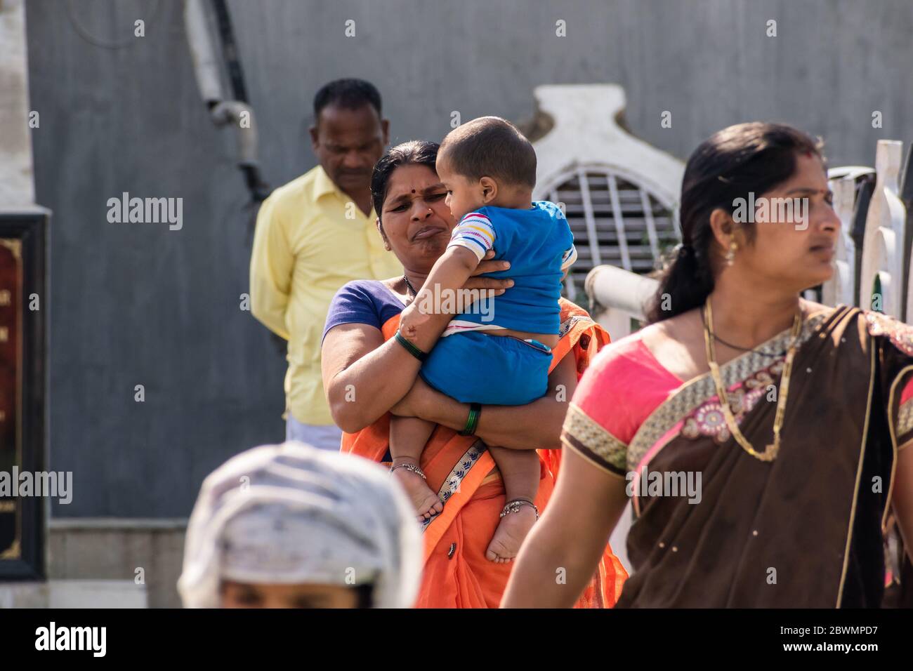 Indian woman carrying baby on hi-res stock photography and images - Alamy