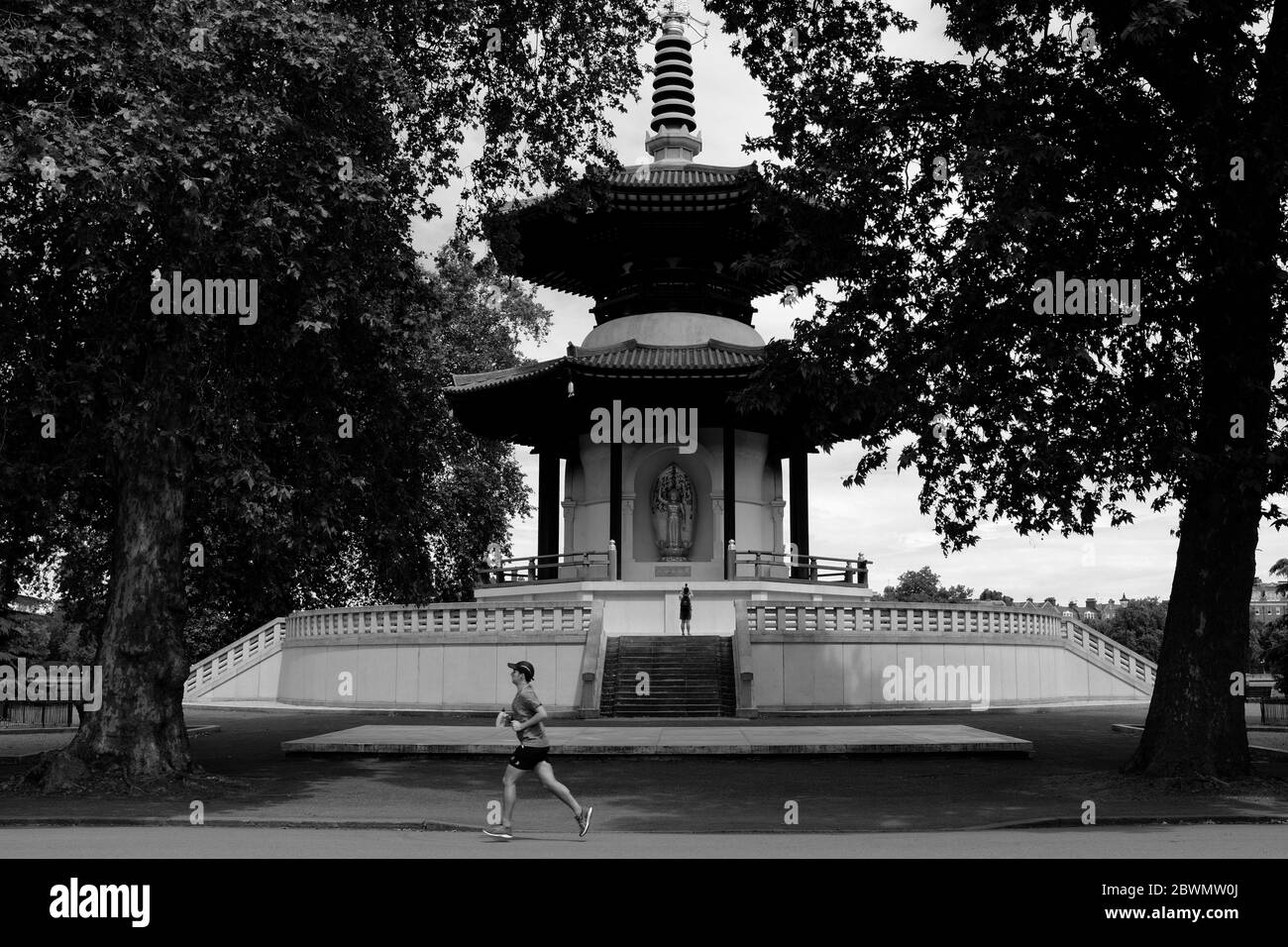 Peace Pagoda in Battersea Park London with runner in foreground in black and white Stock Photo