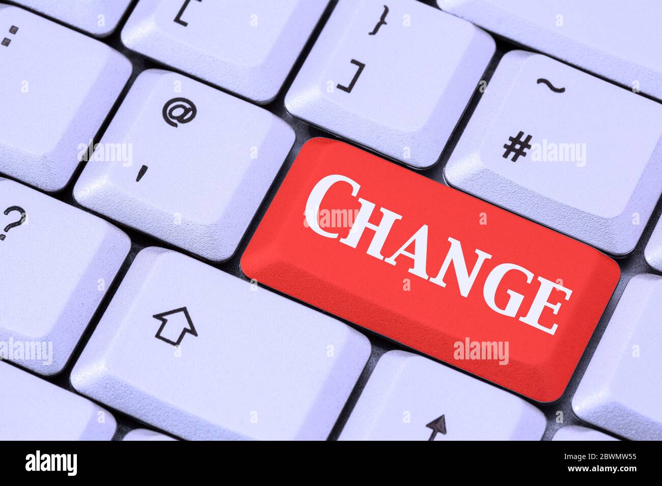 A keyboard with the word CHANGE on a red enter key to illustrate alter making future changes concept. England, UK, Britain Stock Photo
