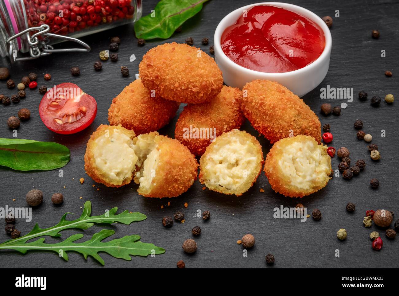 Fried Mozzarella Cheddar Cheese Bites Balls With Ketchup Stock Photo Alamy