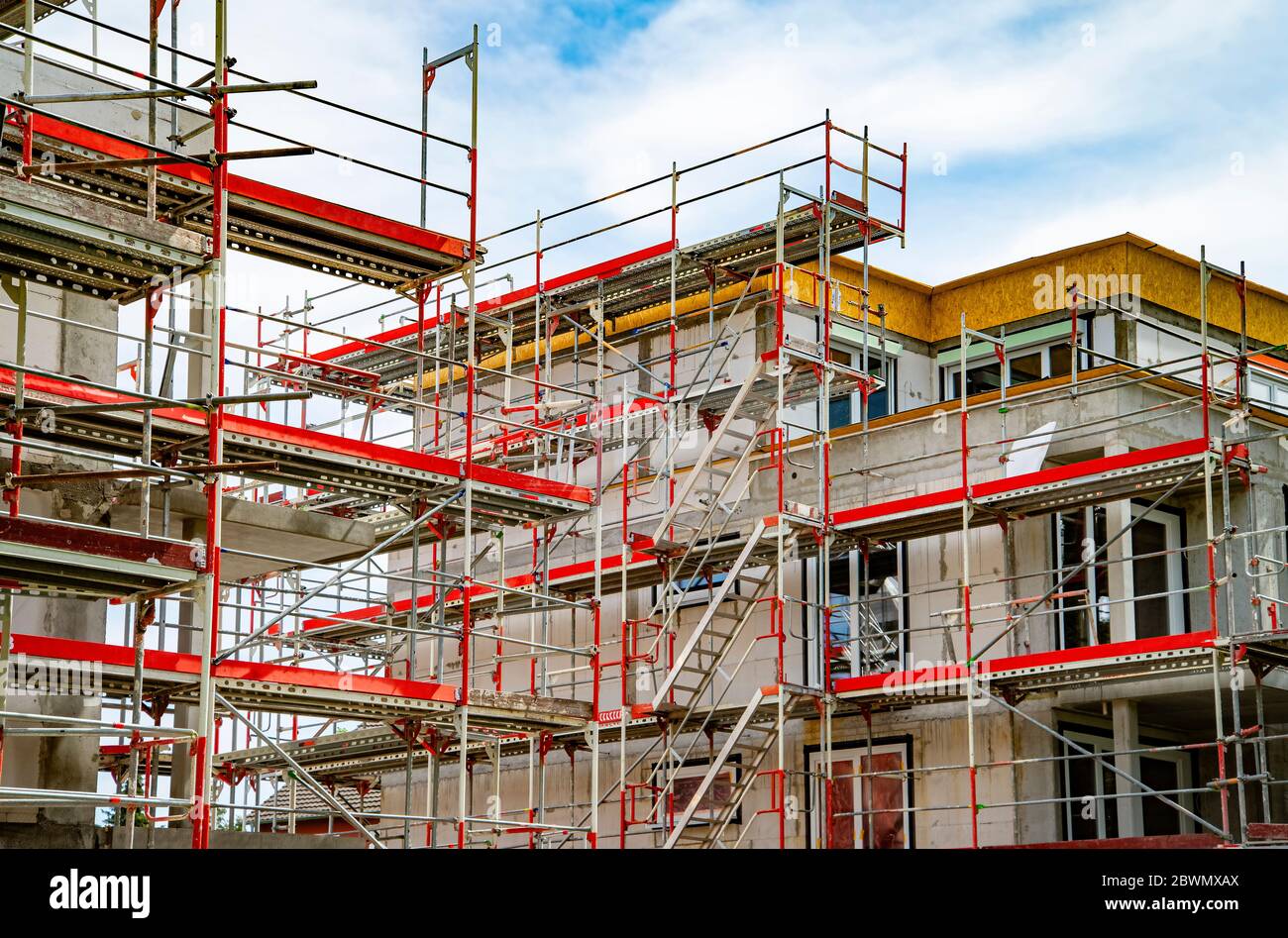 Shell construction of two apartment buildings with scaffolding Stock Photo