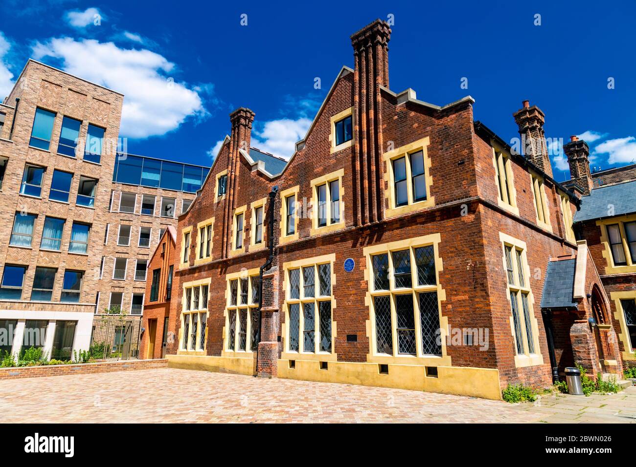 Exterior of Toynbee Hall, charitable institution that works to address the causes and impacts of poverty in the East End of London, UK Stock Photo