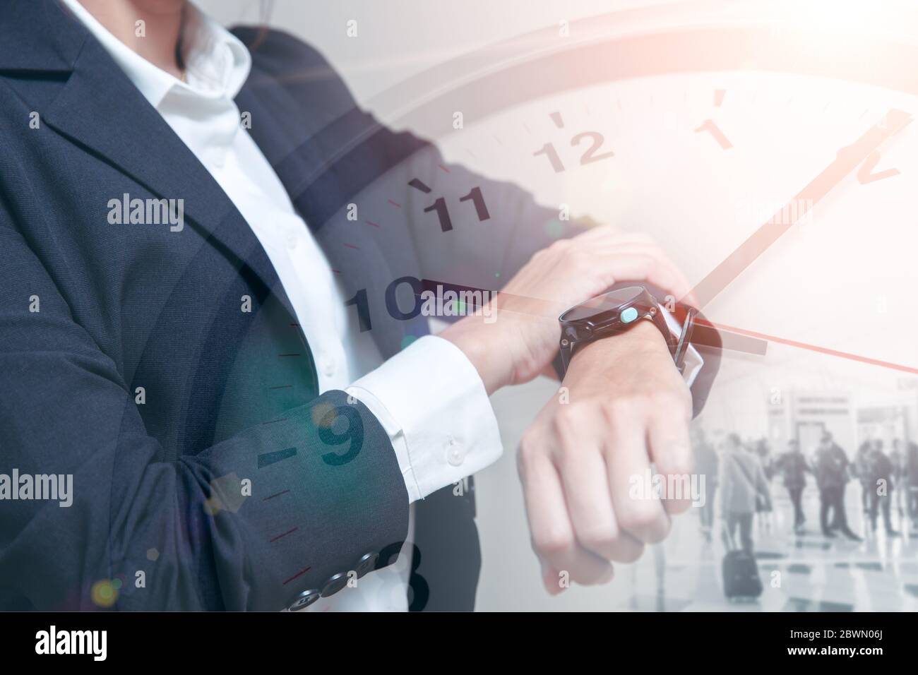 Business times, People looking at wristwatch overlay with time clock face for smart working hours or time schedule concept. Stock Photo