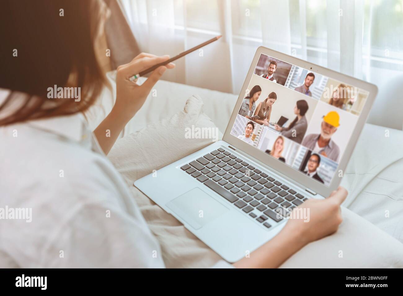 Business women stay home closeup zoom meeting video call with business partner with laptop during self quarantine. Stock Photo