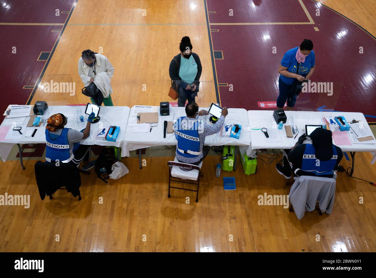 Washington, United States. 02nd June, 2020. Voters wait to check in during the DC primary election at a polling location in Washington, DC on Tuesday, June 2, 2020. Seven states are holding Primaries today amid the COVID-19 pandemic that has killed more than 103,000 people in the United States. Photo by Kevin Dietsch/UPI Credit: UPI/Alamy Live News Stock Photo