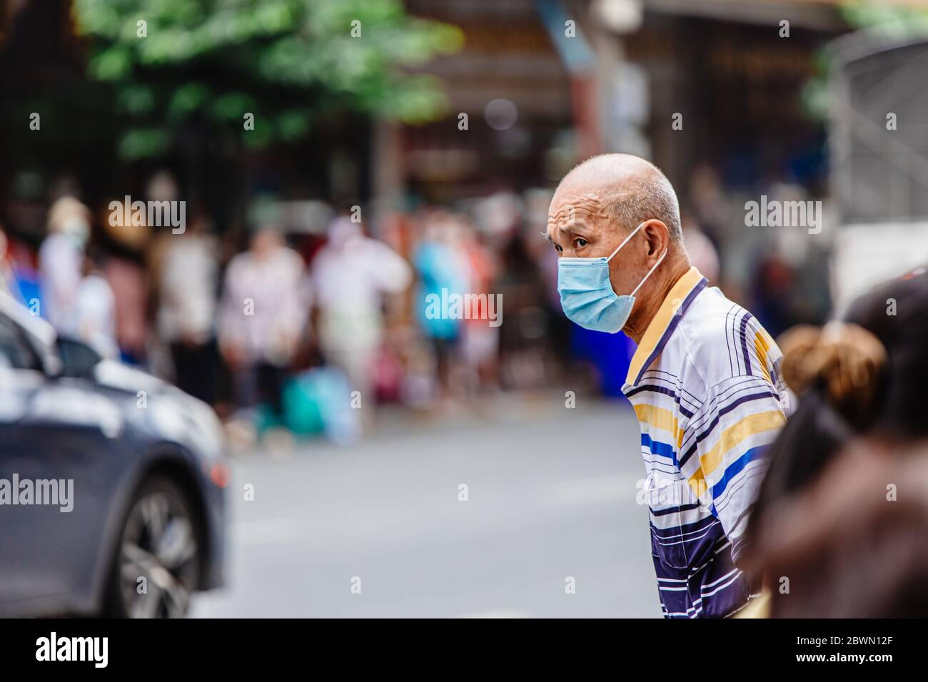 Asian Chinese-Thai elder people reduce anxiety about Coronavirus(Covid-19) outbrake and return to normal life walking at Bangkok Chinatown Yaowarat ma Stock Photo