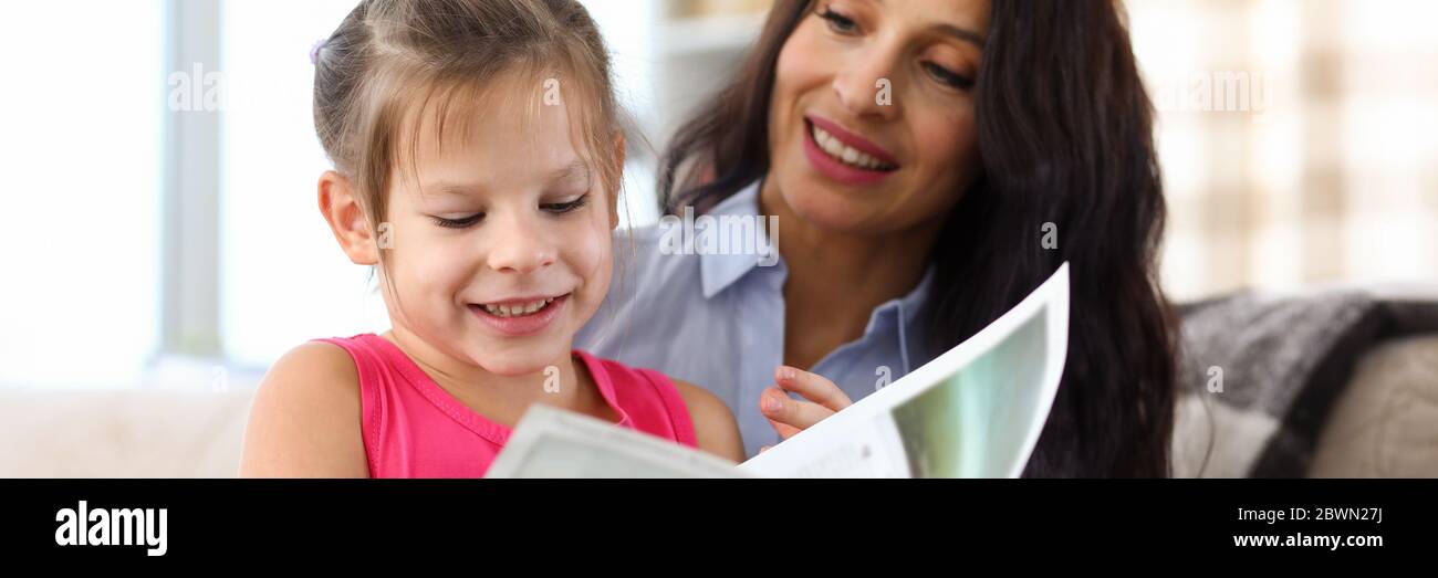 Mum and happy kid spending funny time Stock Photo