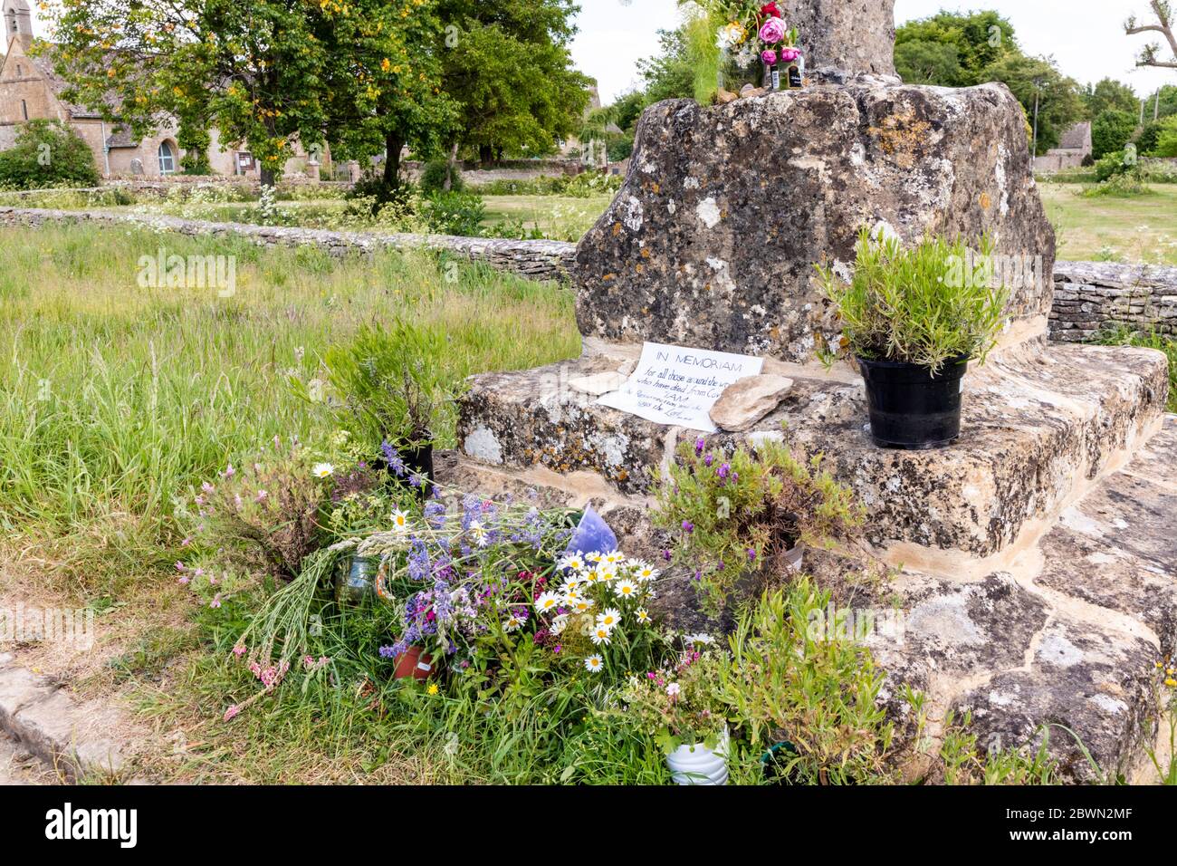 An In Memoriam to victims of Covid 19 on the 14th century wayside cross in the Cotswold village of Condicote, Gloucestershire UK. Stock Photo