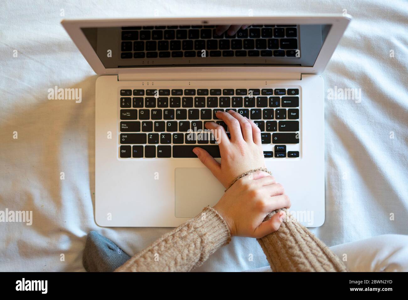 Top view of a female worker with wrist pain from working on the