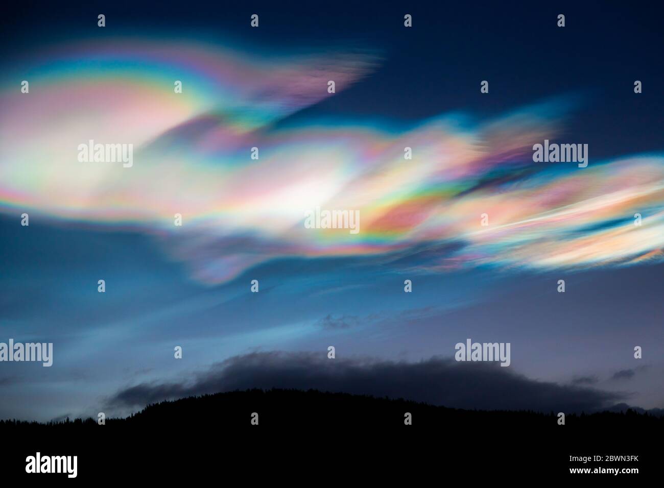 Beautiful and amazing Polar Stratospheric Clouds over Norway, sunsrise time, winter. Stock Photo