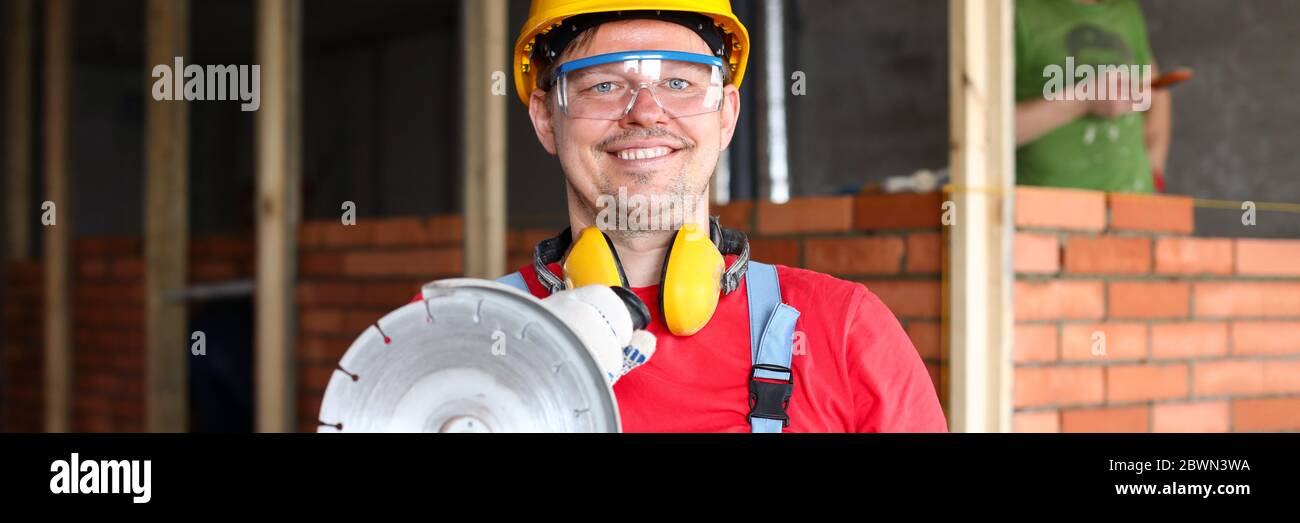 Man holding construction tool Stock Photo