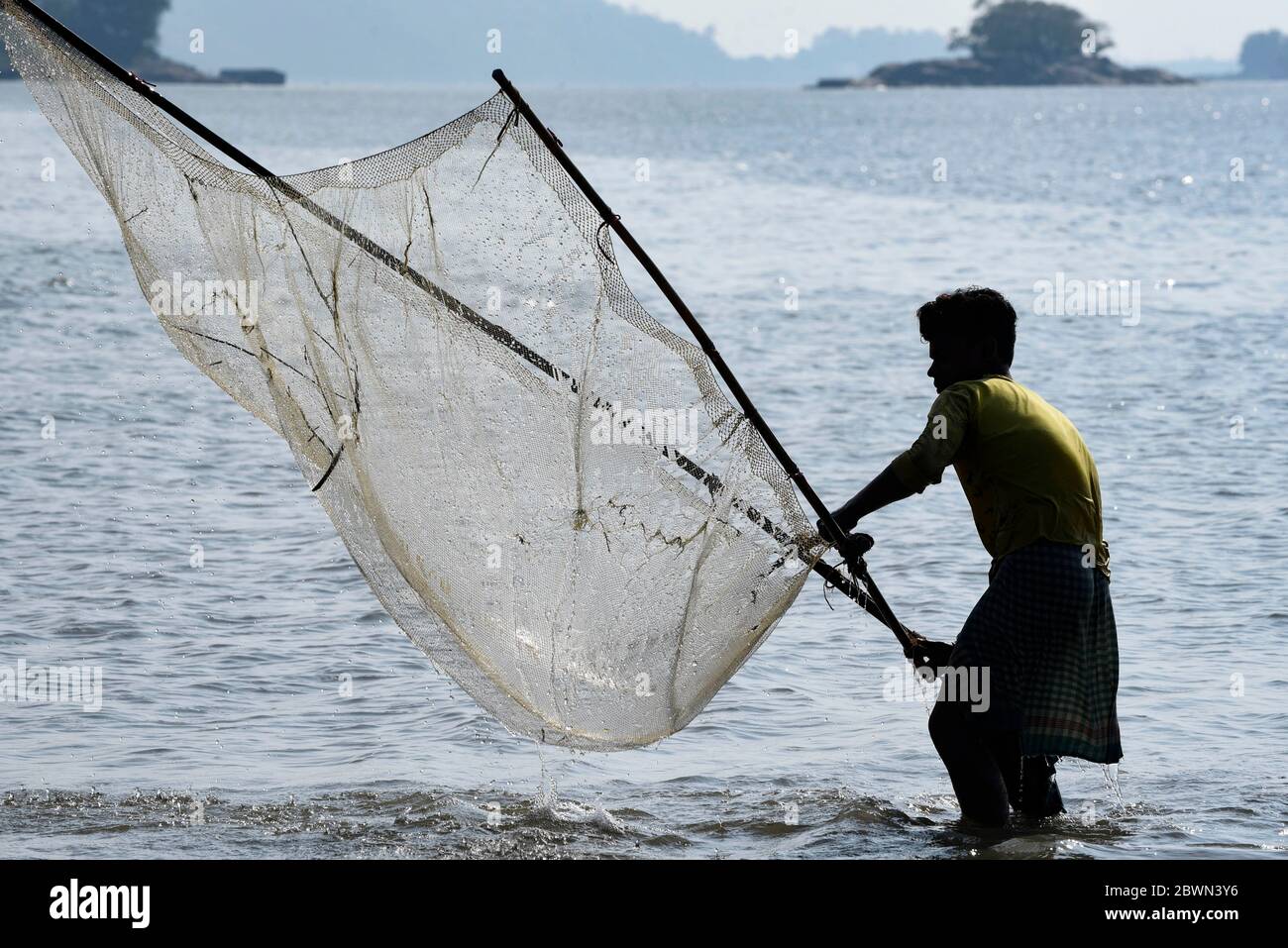 Fisherman fishing in the Brahmaputra river Stock Photo - Alamy