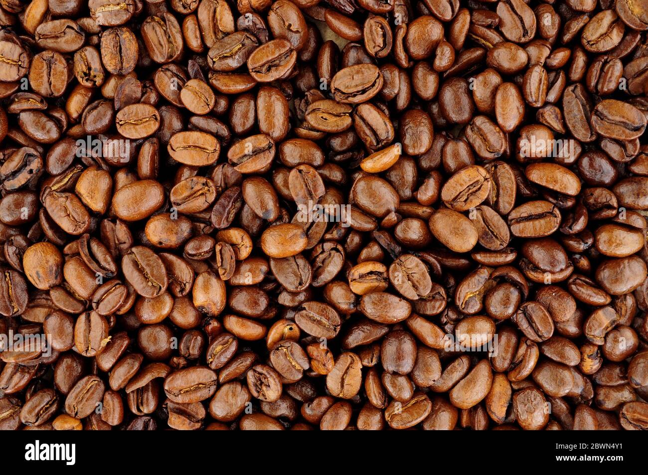Aromatic fresh roasted coffee bean background texture Stock Photo