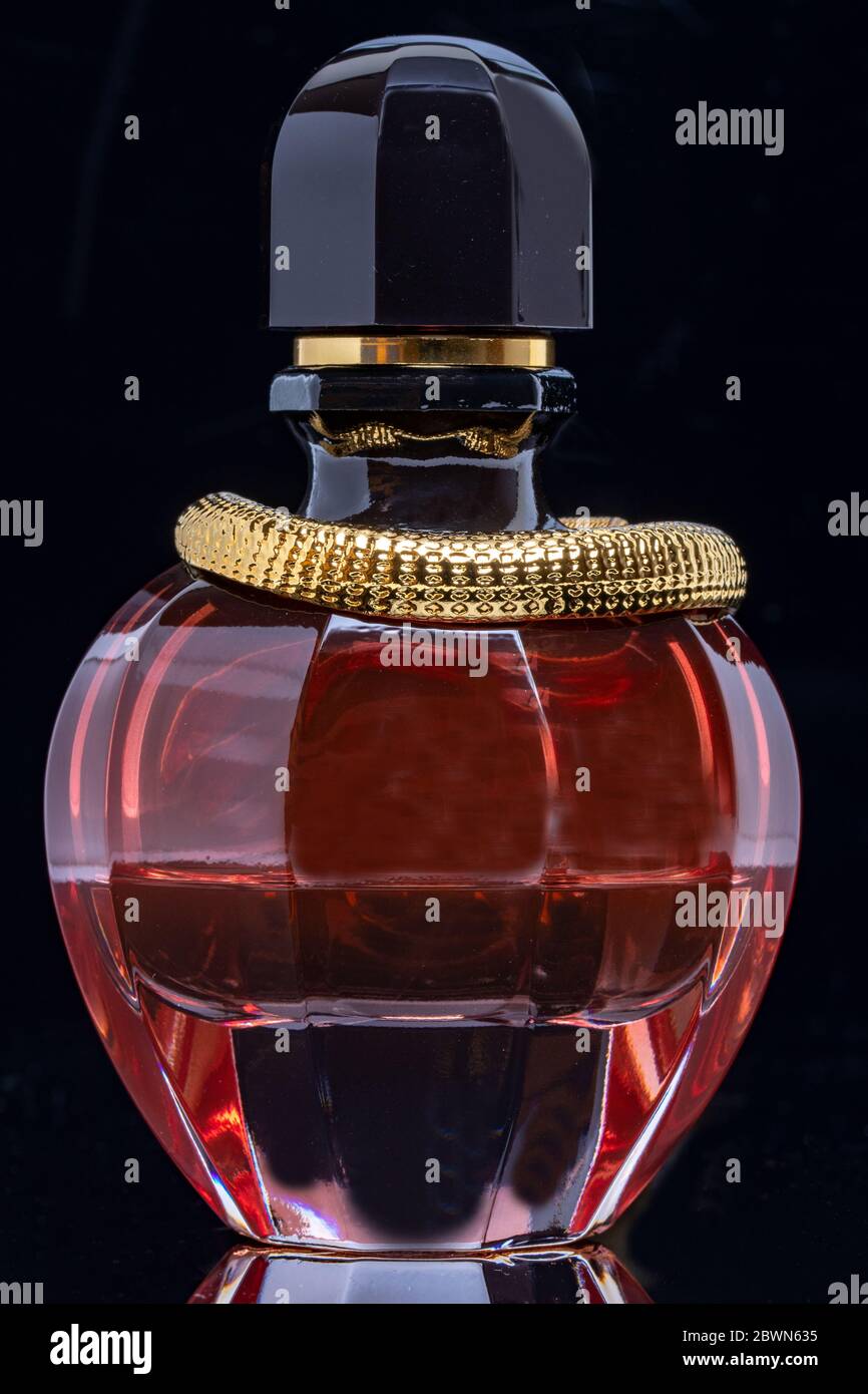 red and gold perfume bottle