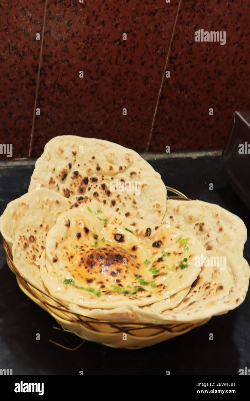 butter naan high resolution stock photography and images alamy https www alamy com homemade butter naan isolated on black background image360039788 html