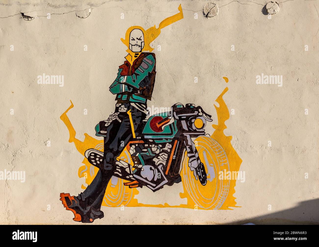 Graffiti of ghost rider with his bike on a wall of a cafe in Ladakh, India. Natural beauty of Ladakh in India. Snow mountains of Ladakh. Famous Ladakh. Stock Photo