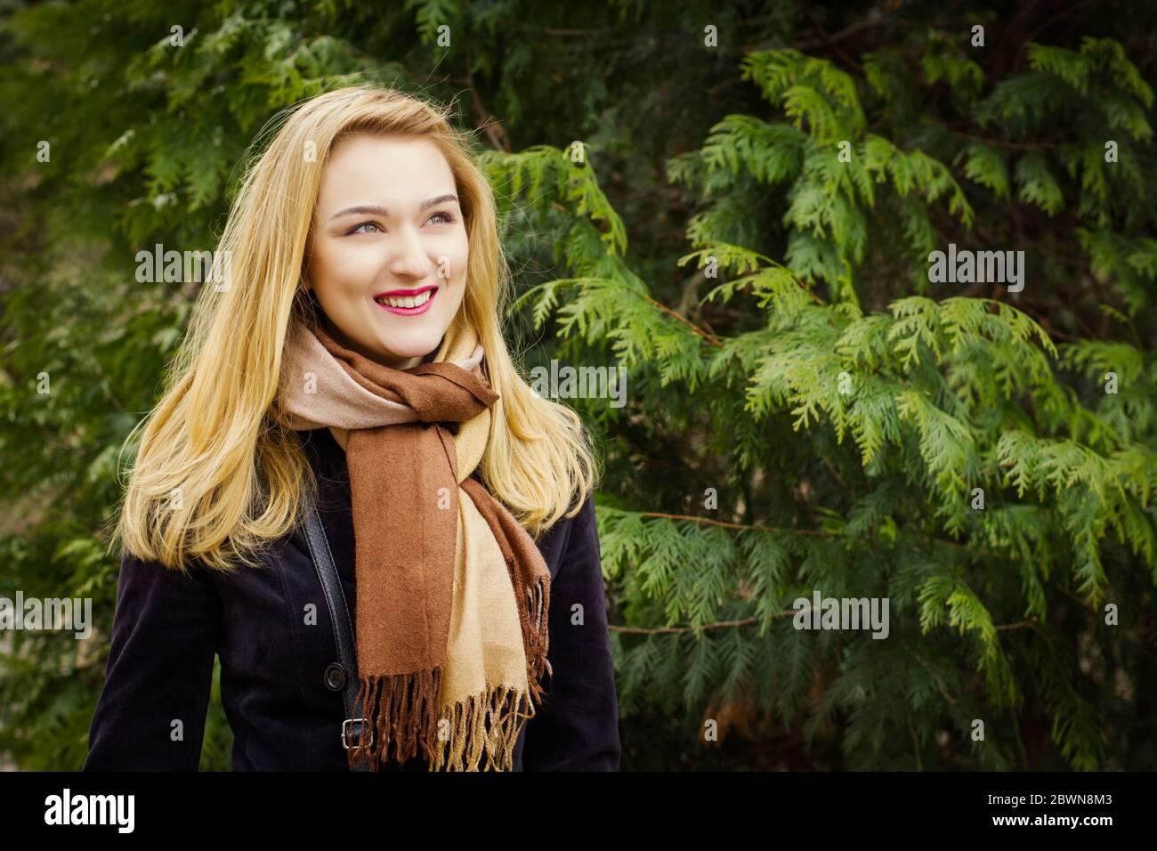 beautiful woman walking in the park in spring Stock Photo - Alamy