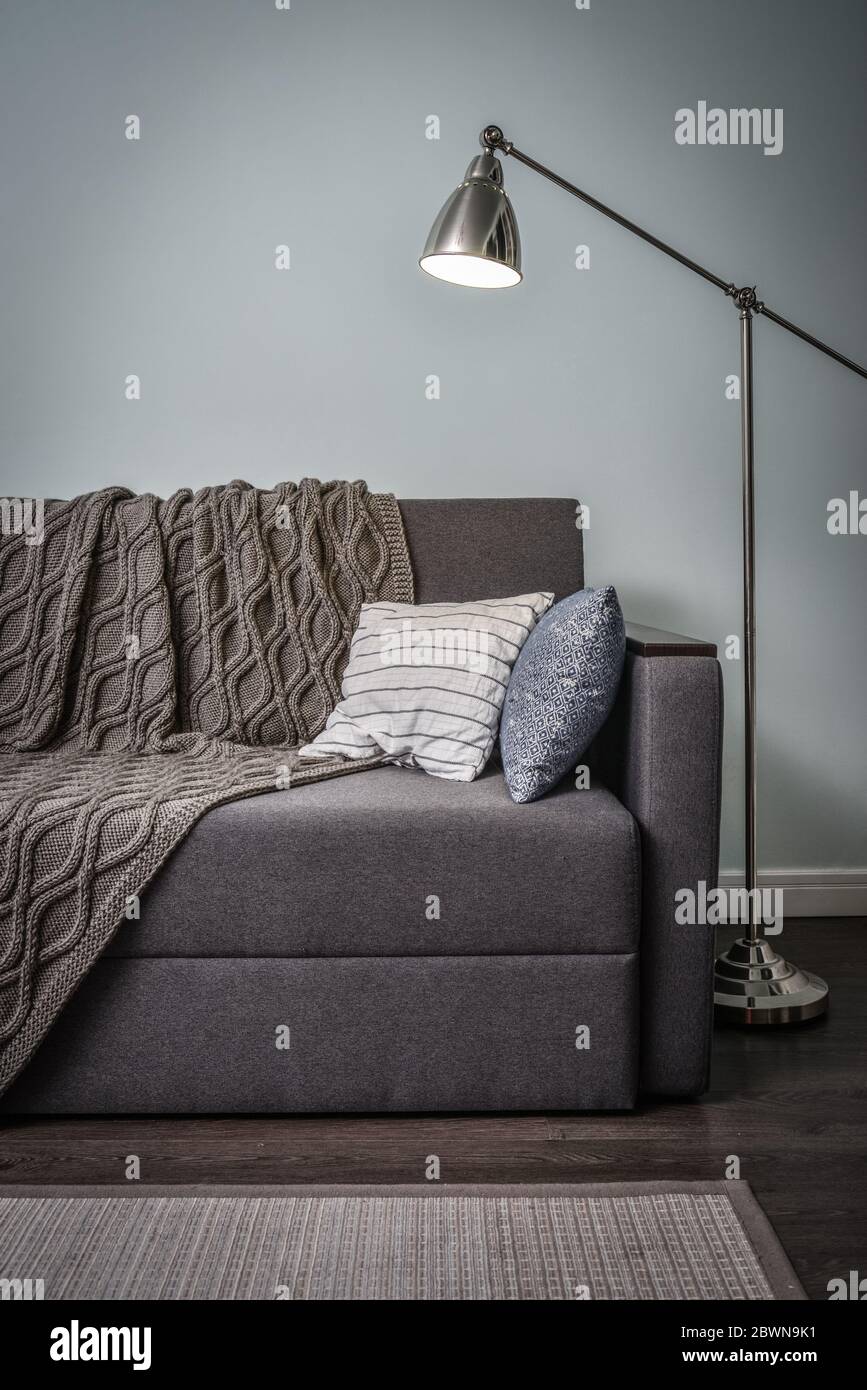 grey couch blue cushions