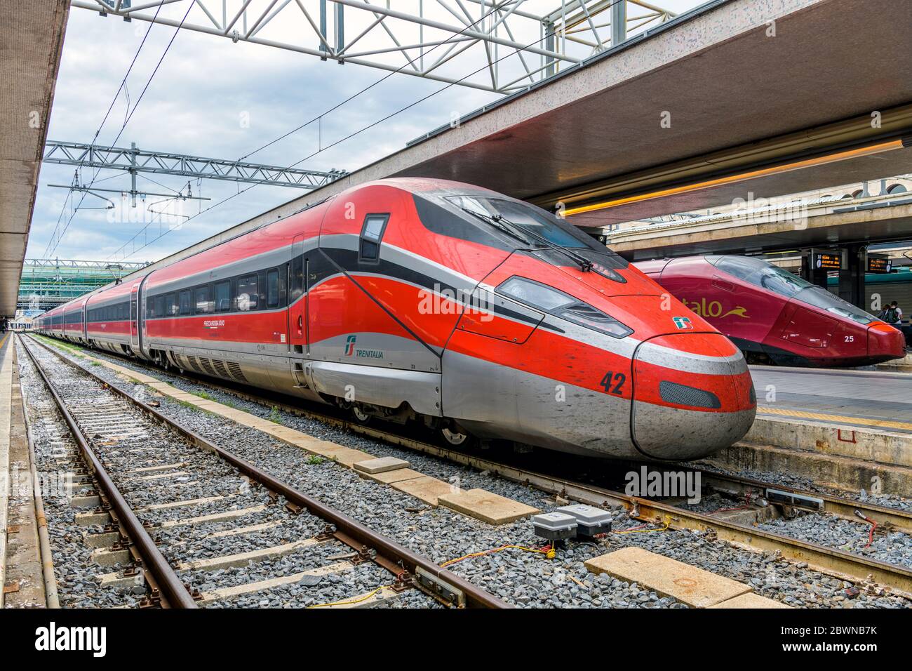 Red Bullet Train - A red high-speed electric train, Frecciarossa 1000 of Trenitalia, parking at a platform in Rome Termini Train Station. Rome, Italy. Stock Photo