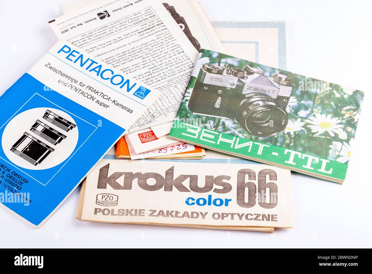 Different old retro vintage photo lens, filter instruction manuals, set of paper booklets. Pentacon, Krokus, Zenit. Russian, Polish and German brands Stock Photo