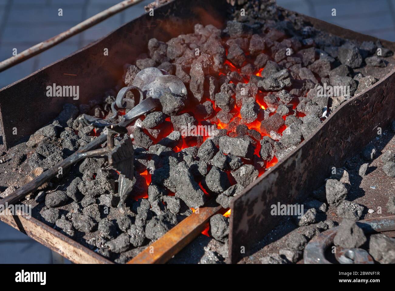 Forge, brazier with hot coals, equipment close-up Stock Photo