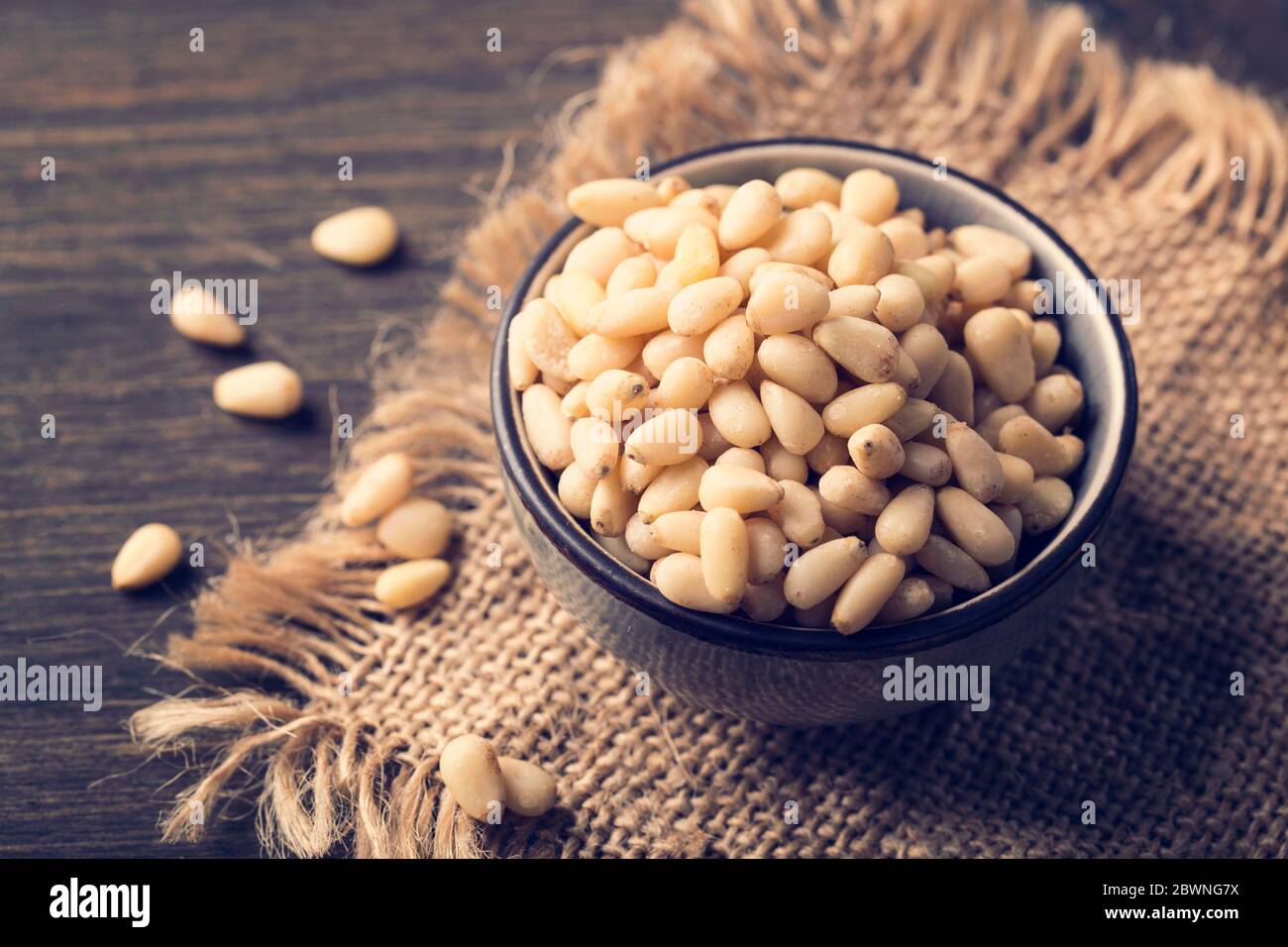 Cedar pine nuts in a wooden spoon Stock Photo