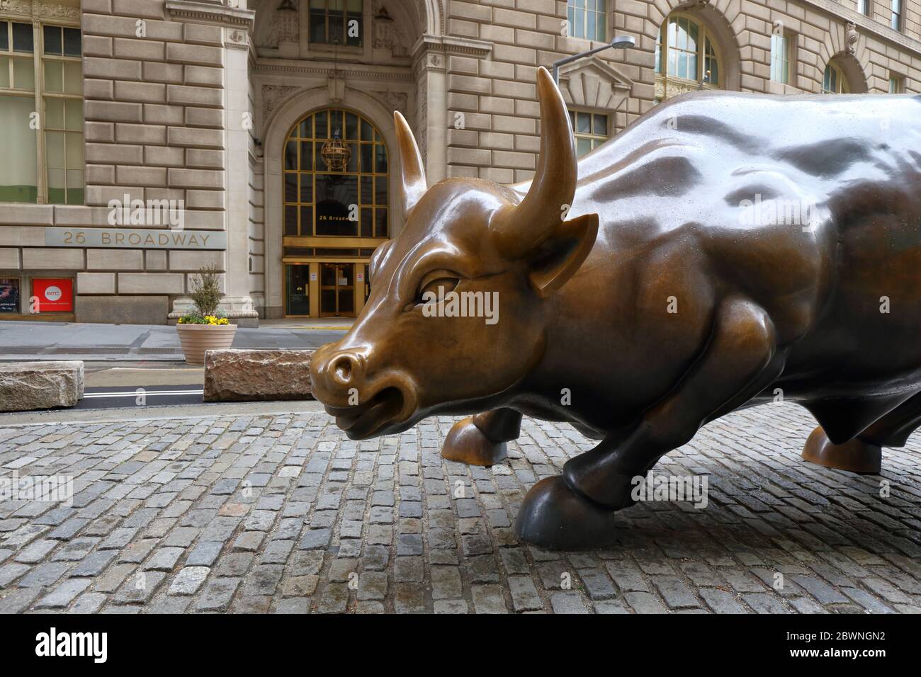 Charging Bull by Arturo Di Modica, in front of 26 Broadway, New York.  A bronze sculpture that has come to represent Wall Street. no people Stock Photo