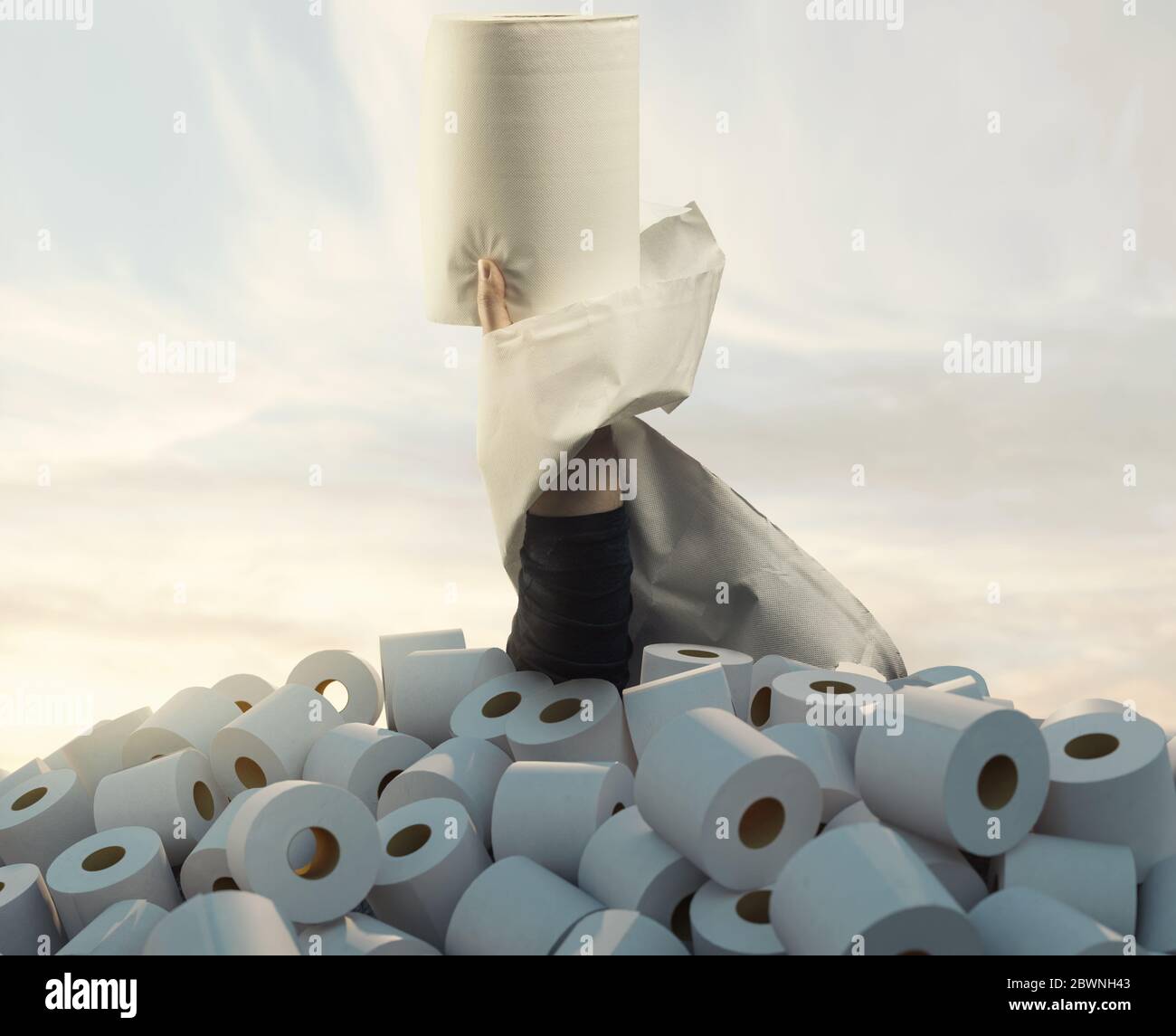 hand raising with a big toilet paper from a heap full of toilet paper