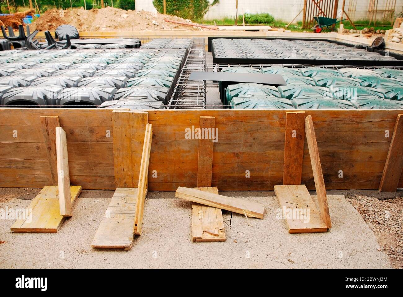 House foundation site with steel reinforcement cages & radon iglus