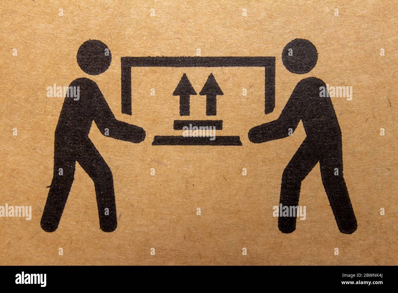 Packaging symbol to indicate heaviness and needs two people to lift Stock Photo