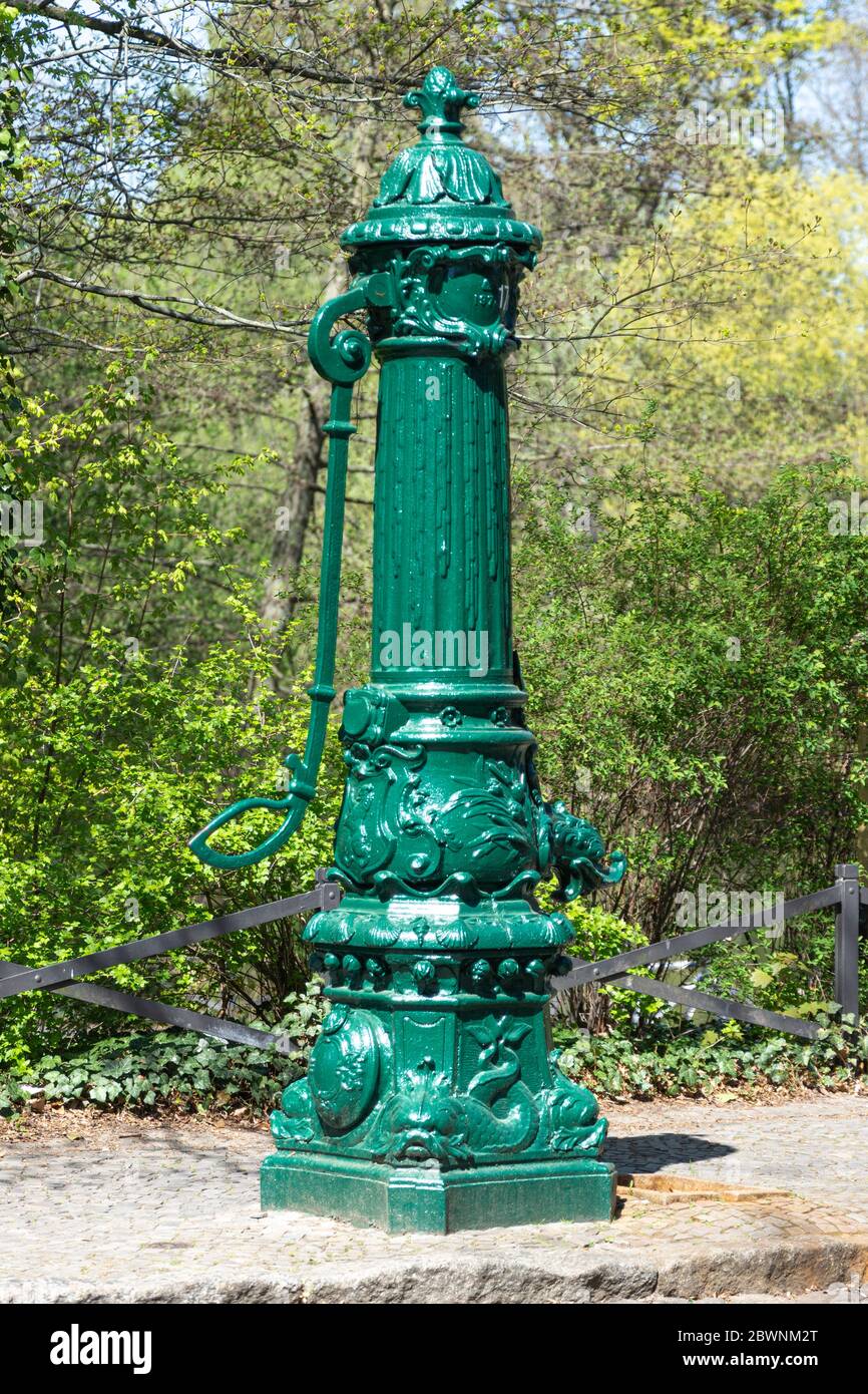 Nostalgic water pump on the sidewalk in Berlin Stock Photo