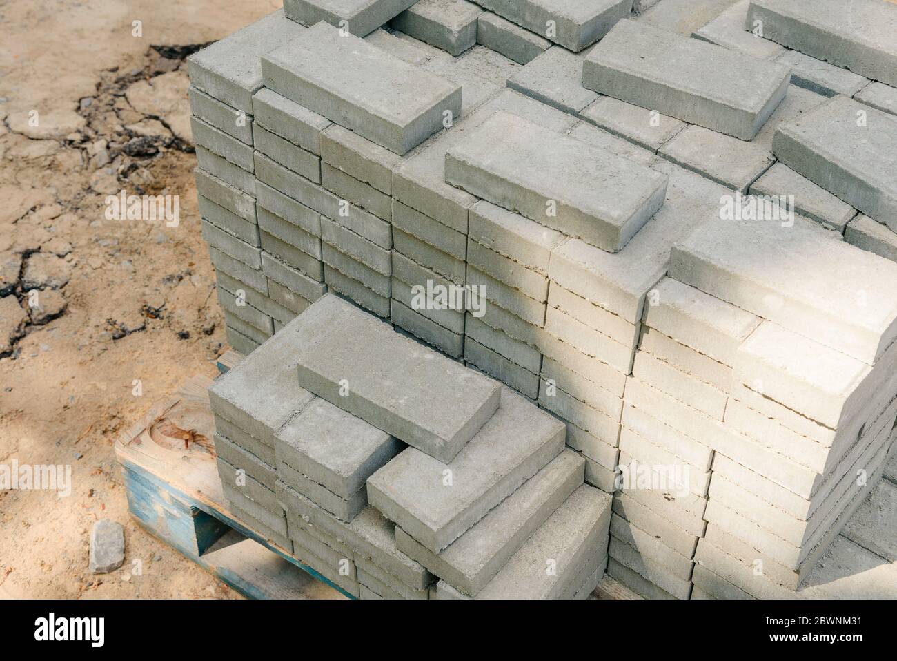 Paving tile stack on the street. Construction materials for site improvement. Stock Photo