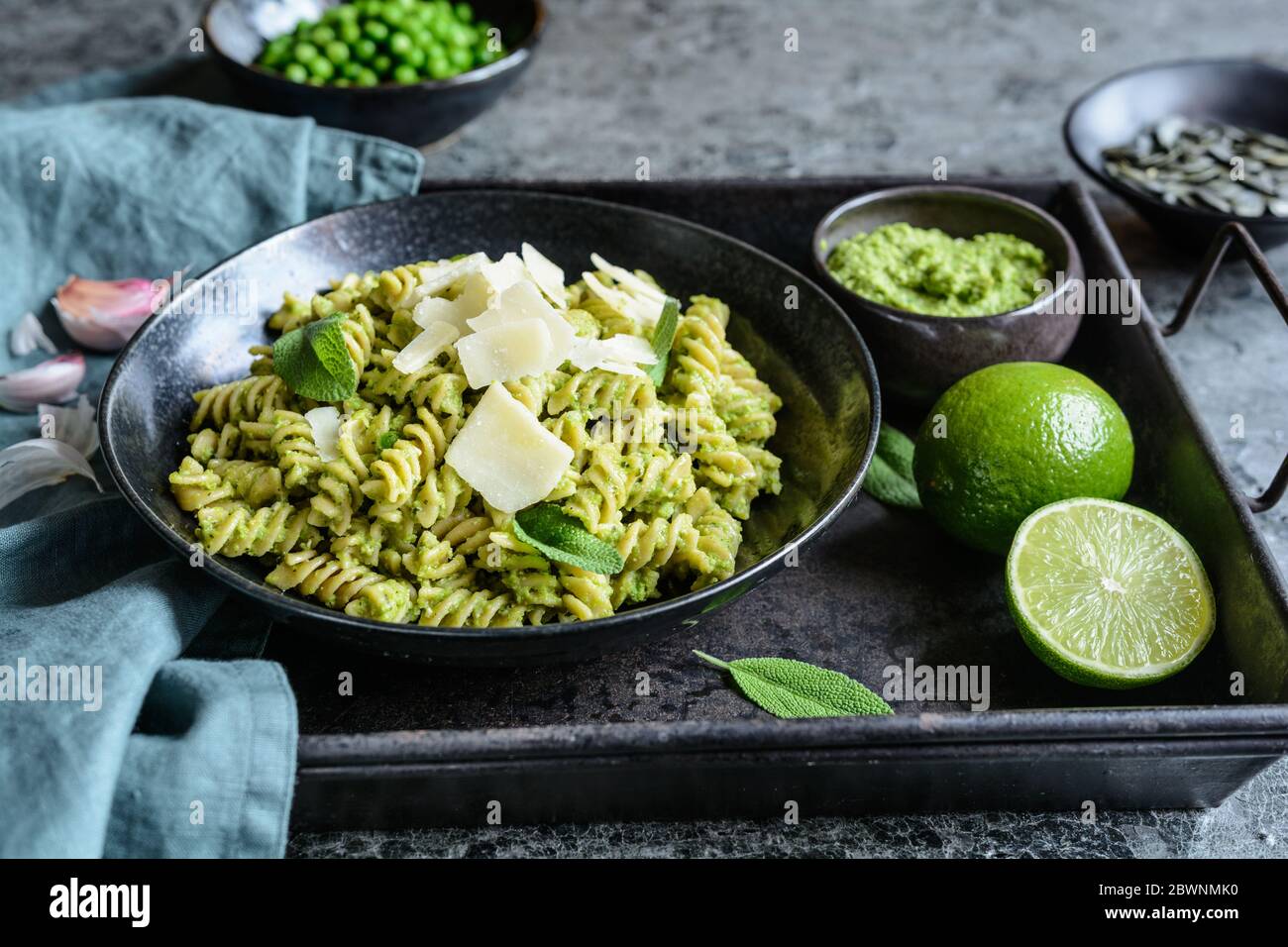 Fusilli pasta with pea pesto made from sage and pumpkin seeds topped
