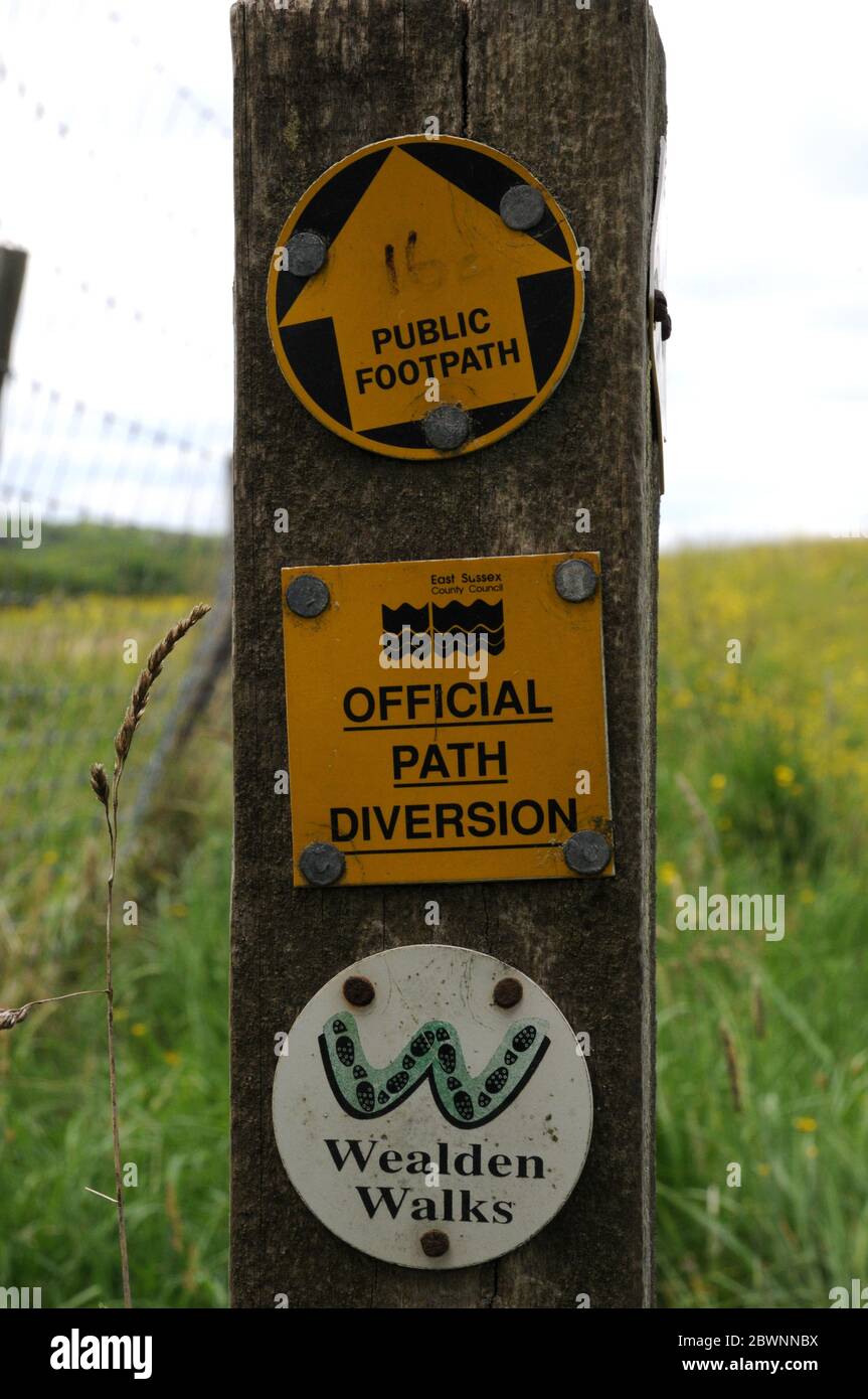 Signpost showing a Wealden Walk and a public footpath near Mayfield in the High Weald of East Sussex. Stock Photo