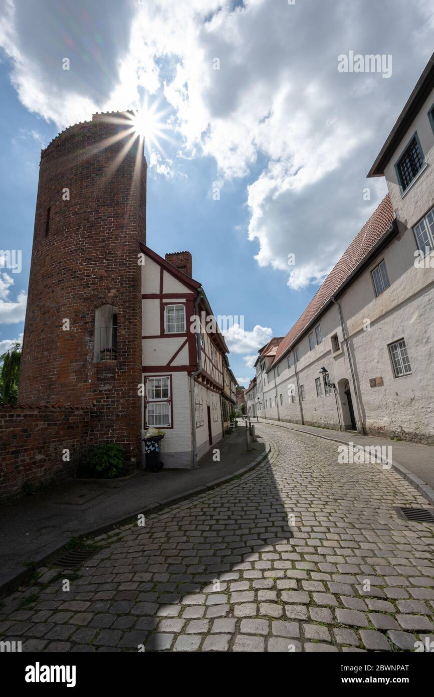 Half tower from the 13th century in the former city wall with later added half-timbered house in the old town of the hanseatic city Luebeck, Germany, Stock Photo
