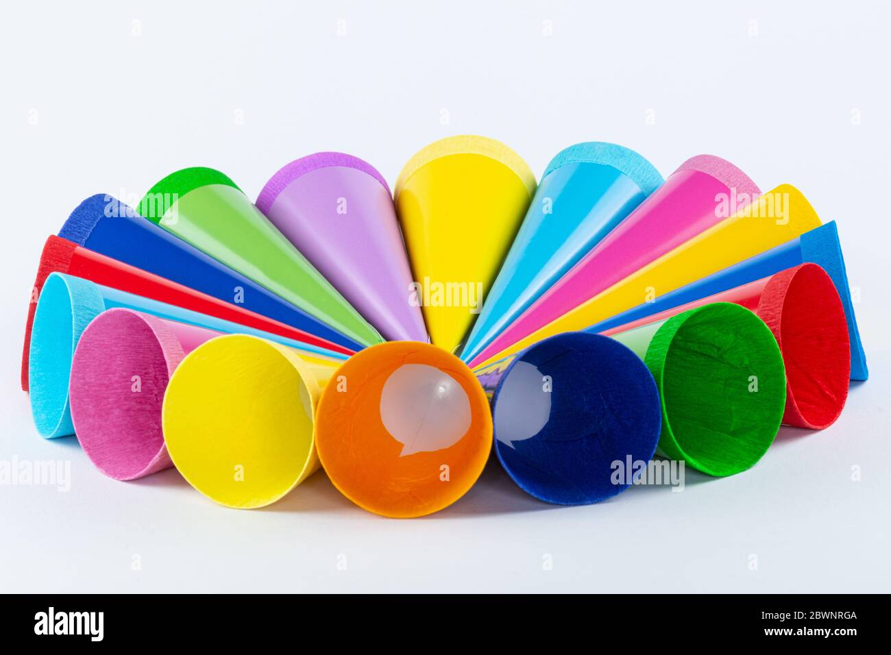 Many colorful small sugar bags arranged in a circle on a light background Stock Photo