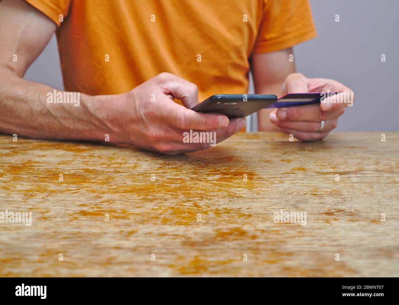 Online spending with bank card and smartphone Stock Photo