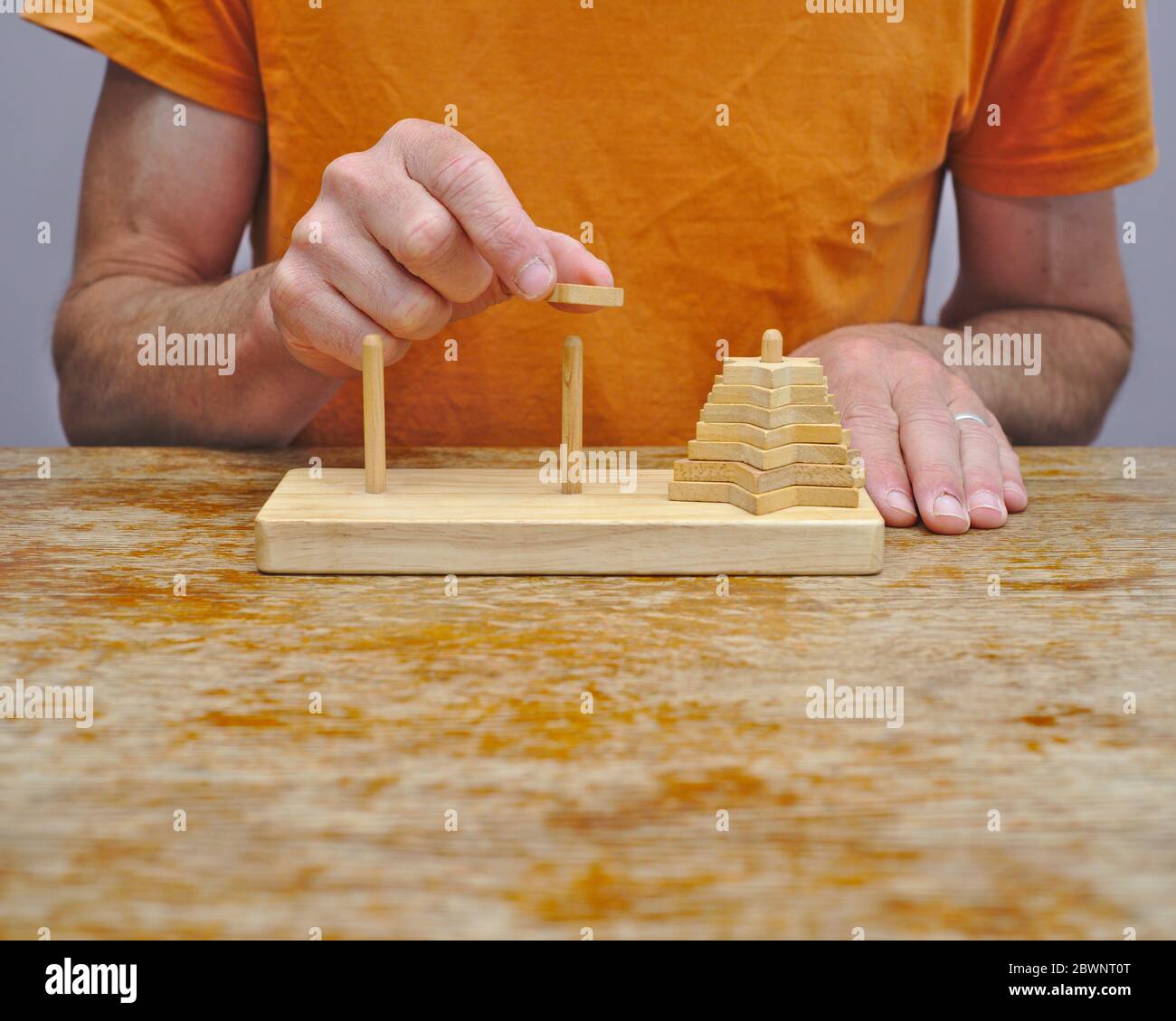 Man Playing Math Man playing Tower of Hanoi mathematical game Stock Photo - Alamy